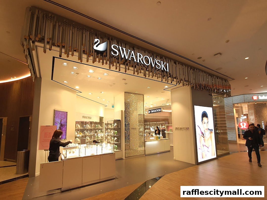 The entrance of a Swarovski store with sparkling displays and a large advertisement.