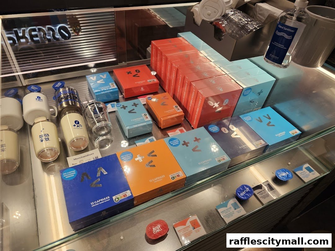 Display of coffee capsules, mugs, and hand sanitizer at TAG Espresso.