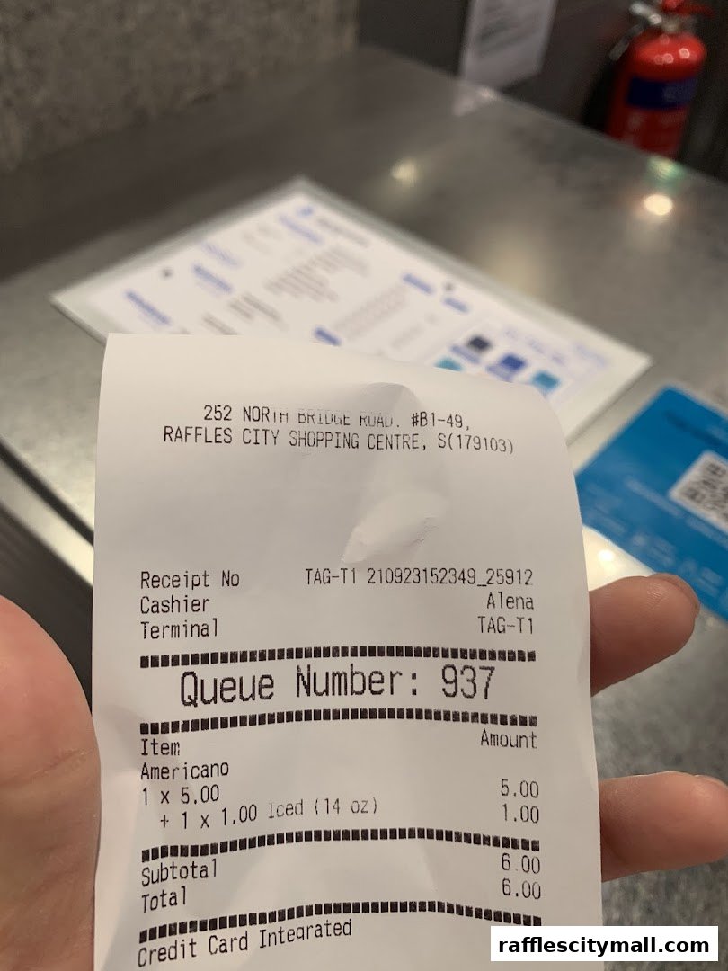 A receipt from TAG Espresso at Raffles City Shopping Centre showing an Americano order.