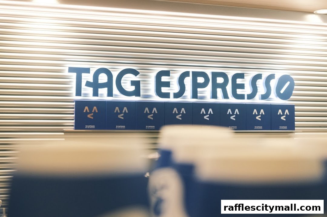 The TAG Espresso sign with rows of coffee capsules displayed below.