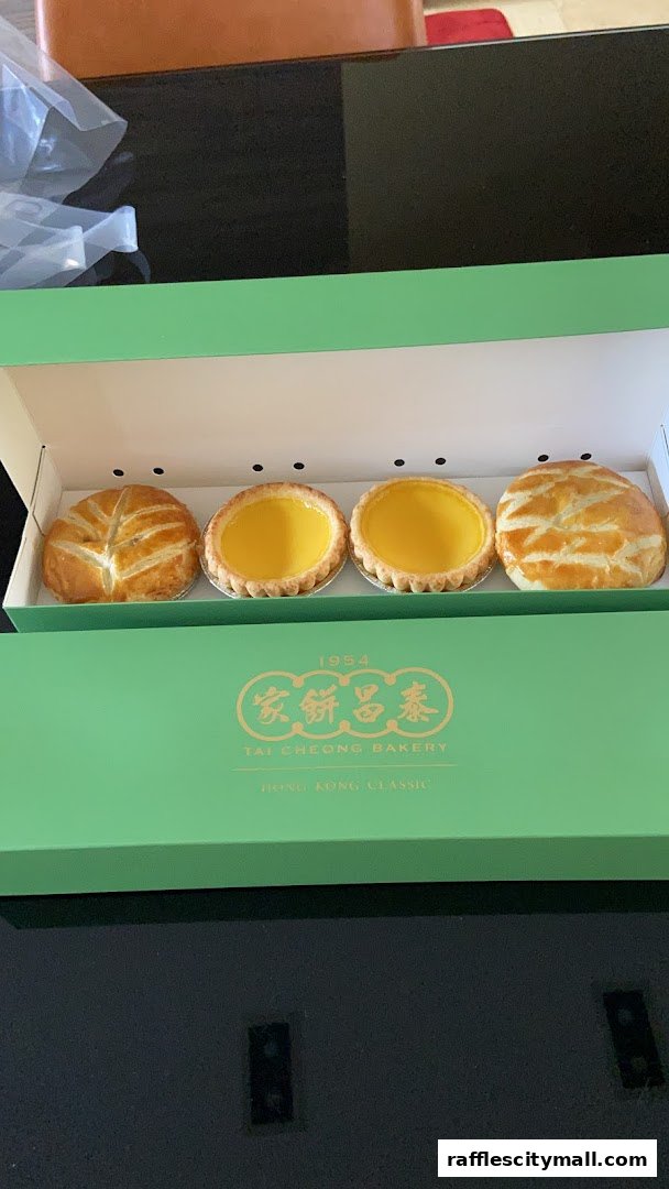 A box of Tai Cheong Bakery's signature egg tarts and pastries.