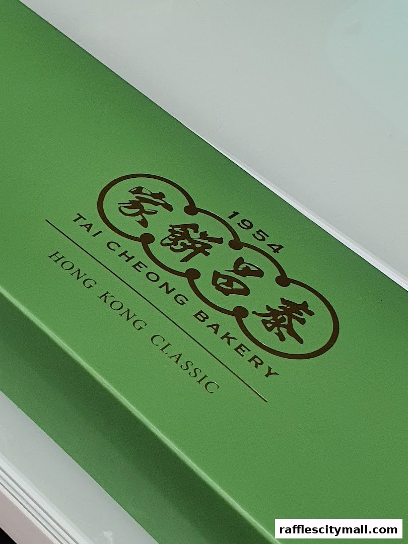 A green box with the Tai Cheong Bakery logo and text.