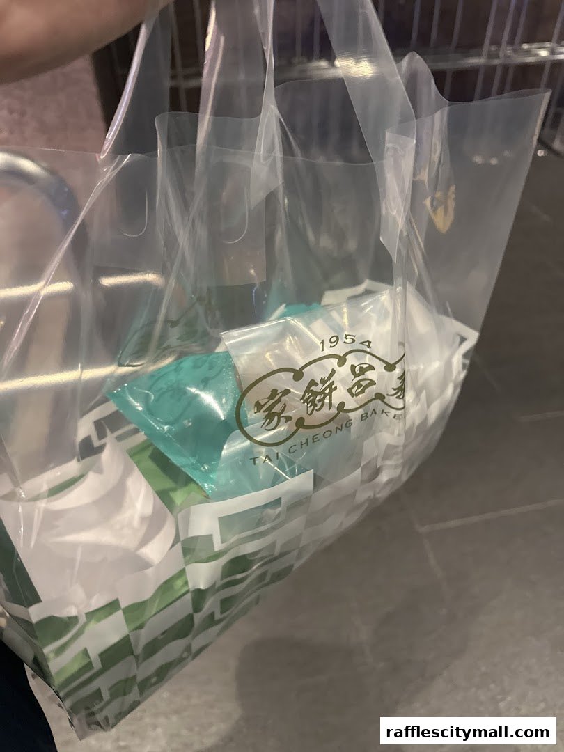 A plastic bag from Tai Cheong Bakery filled with various baked goods.