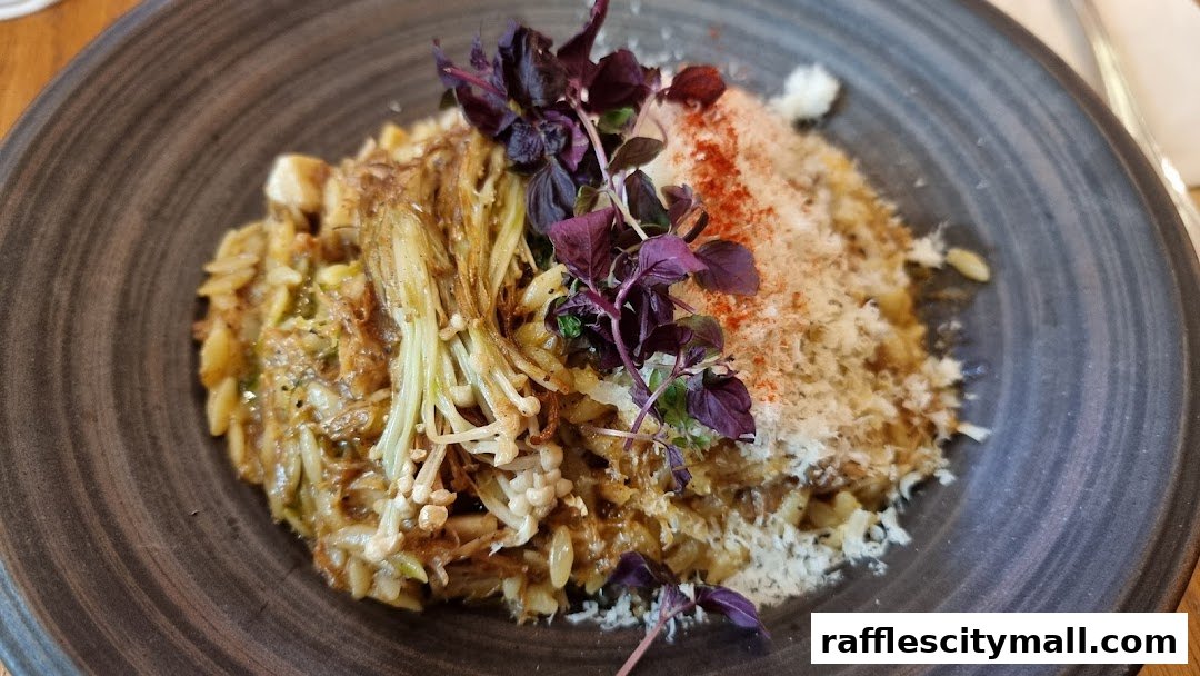 A close-up of a delicious pasta dish with mushrooms and herbs on a dark plate.