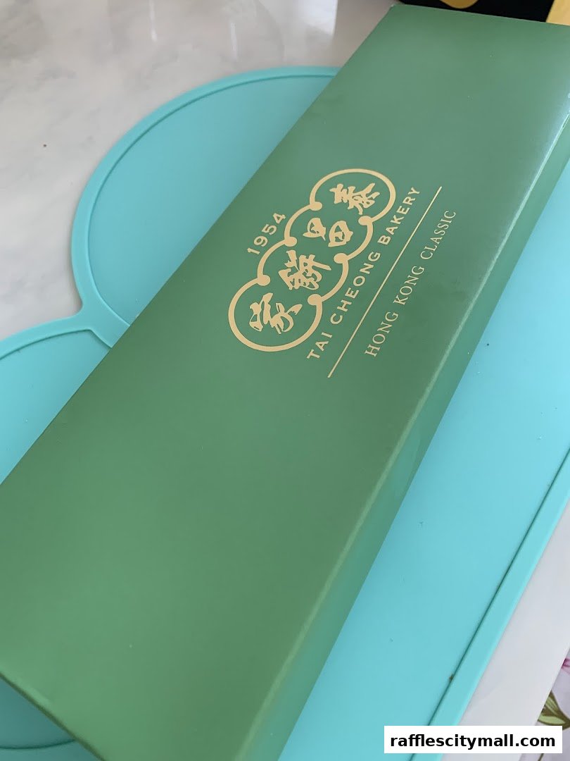 A green box with gold lettering from Tai Cheong Bakery.