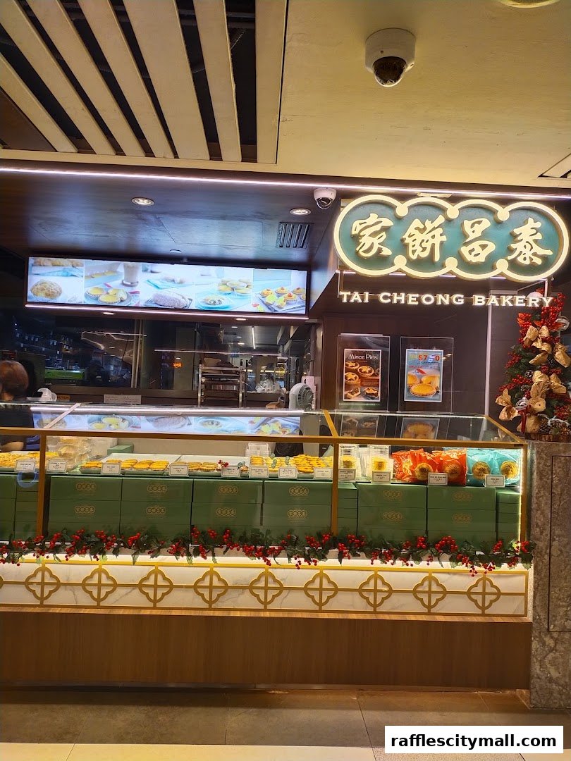 The exterior of Tai Cheong Bakery, showcasing a display of pastries and branded gift boxes.