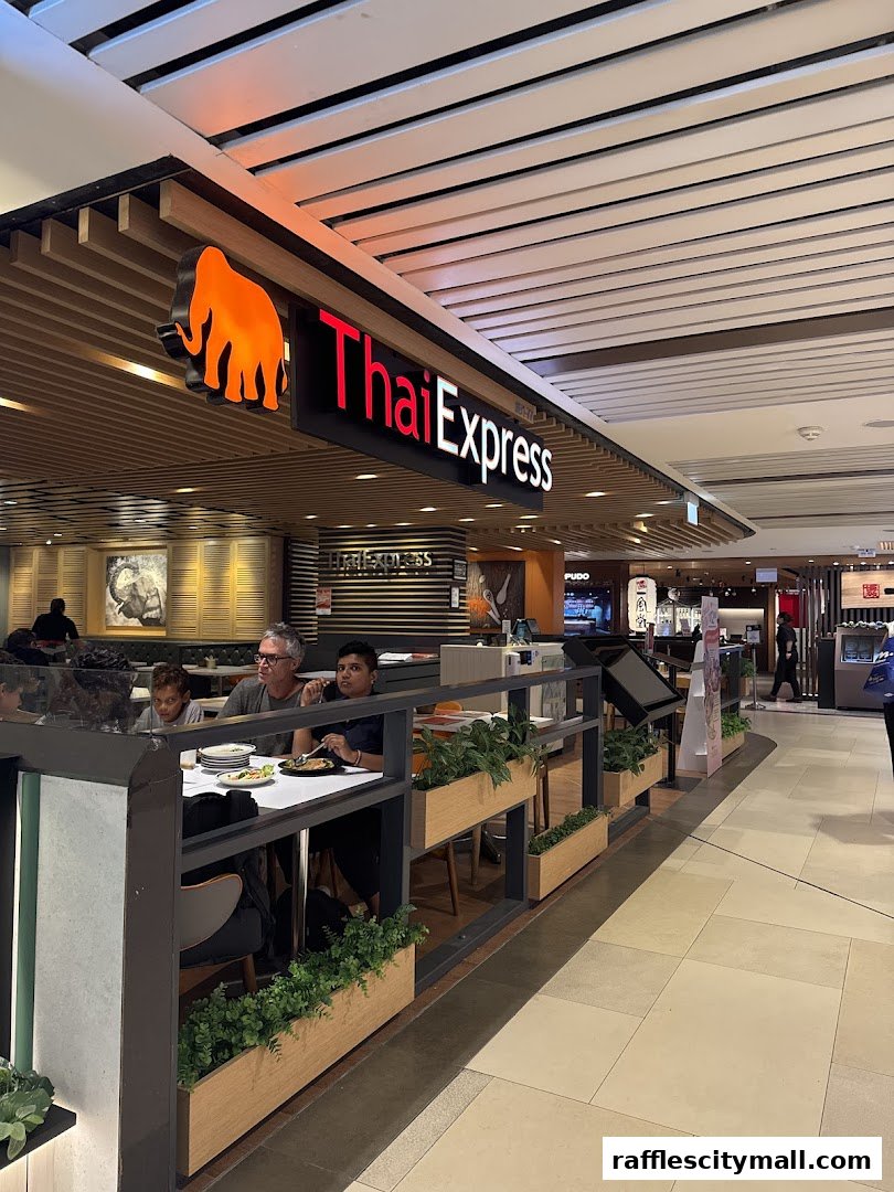 People dining at Thai Express restaurant with its prominent signage.