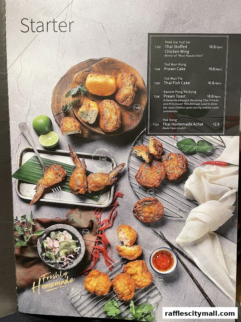 A menu page showcasing various Thai starter dishes with appealing food photography.