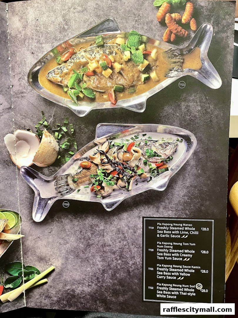A menu page from Thai Express featuring two whole steamed fish dishes.