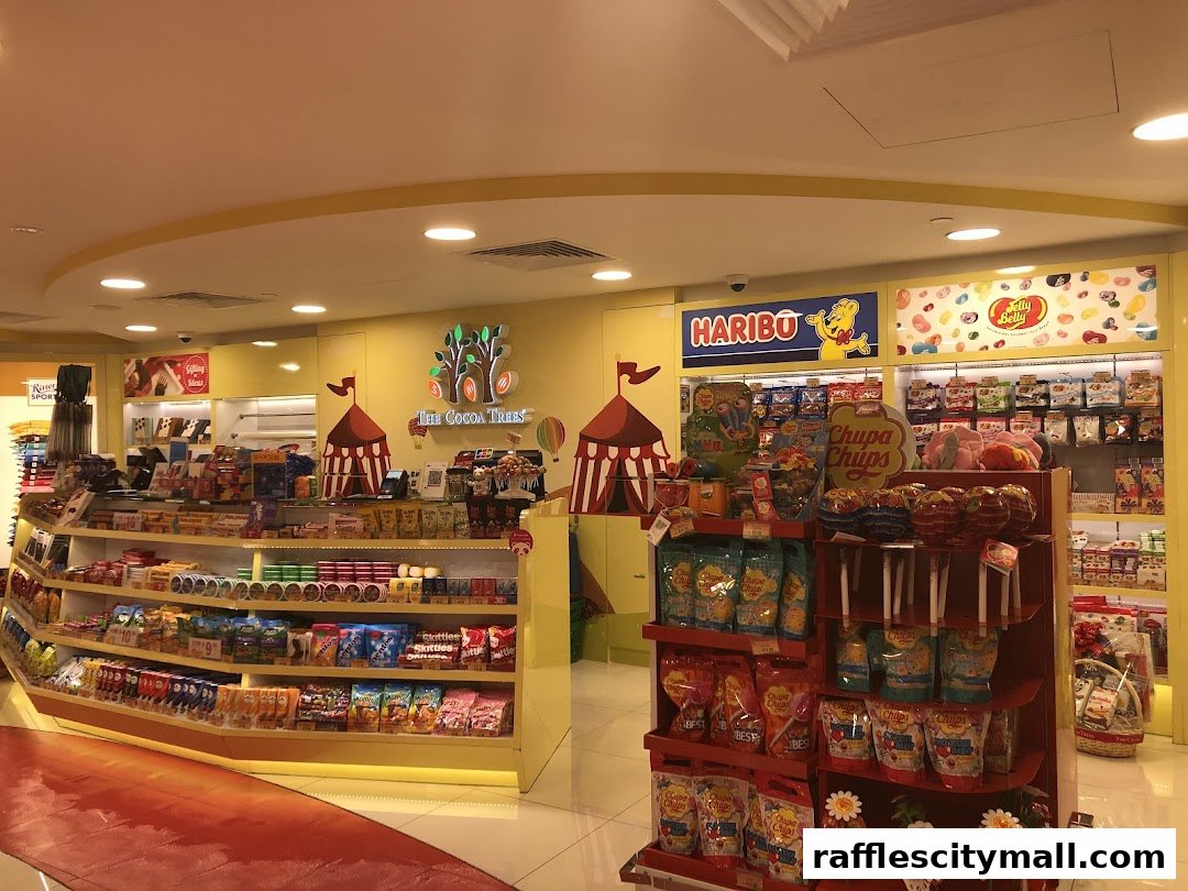 Interior view of a brightly lit candy store with shelves stocked with various sweets and chocolates.