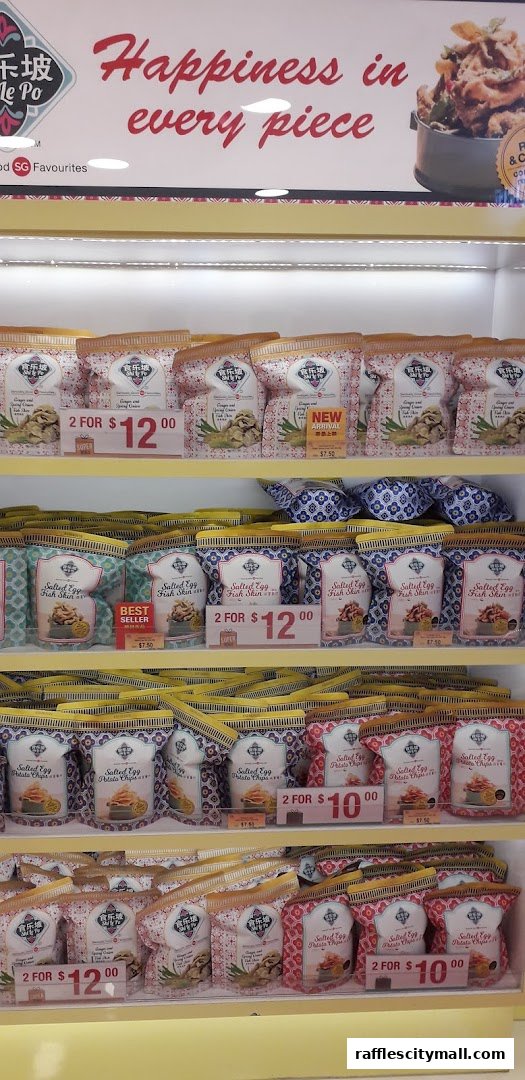 Shelves stocked with various flavors of salted egg snacks from The Cocoa Trees.