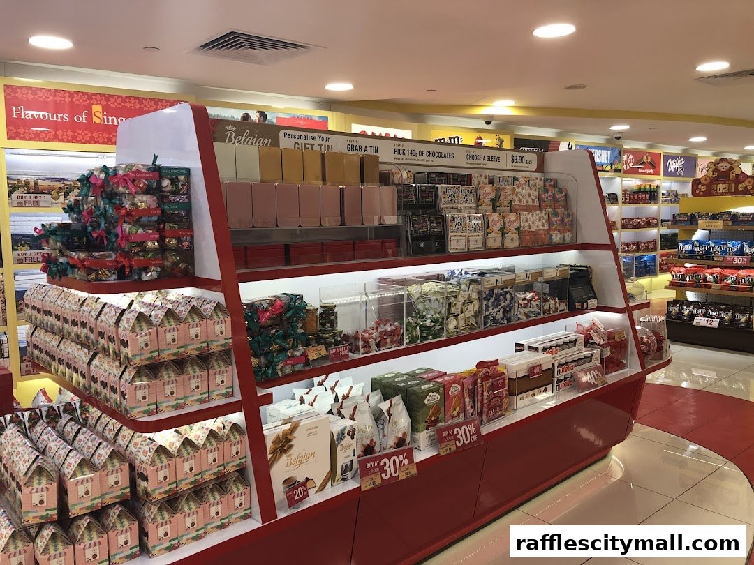 Interior view of a chocolate shop with various chocolates and gift sets displayed.