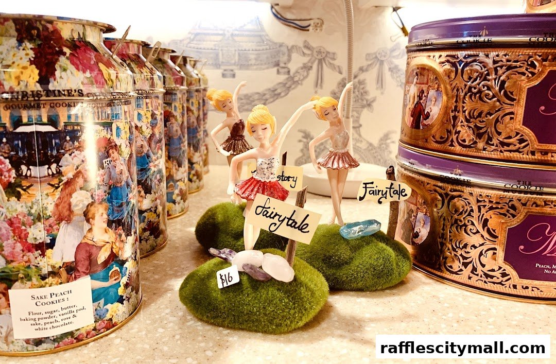 A display of decorative cookie tins and ballerina figurines with price tags.
