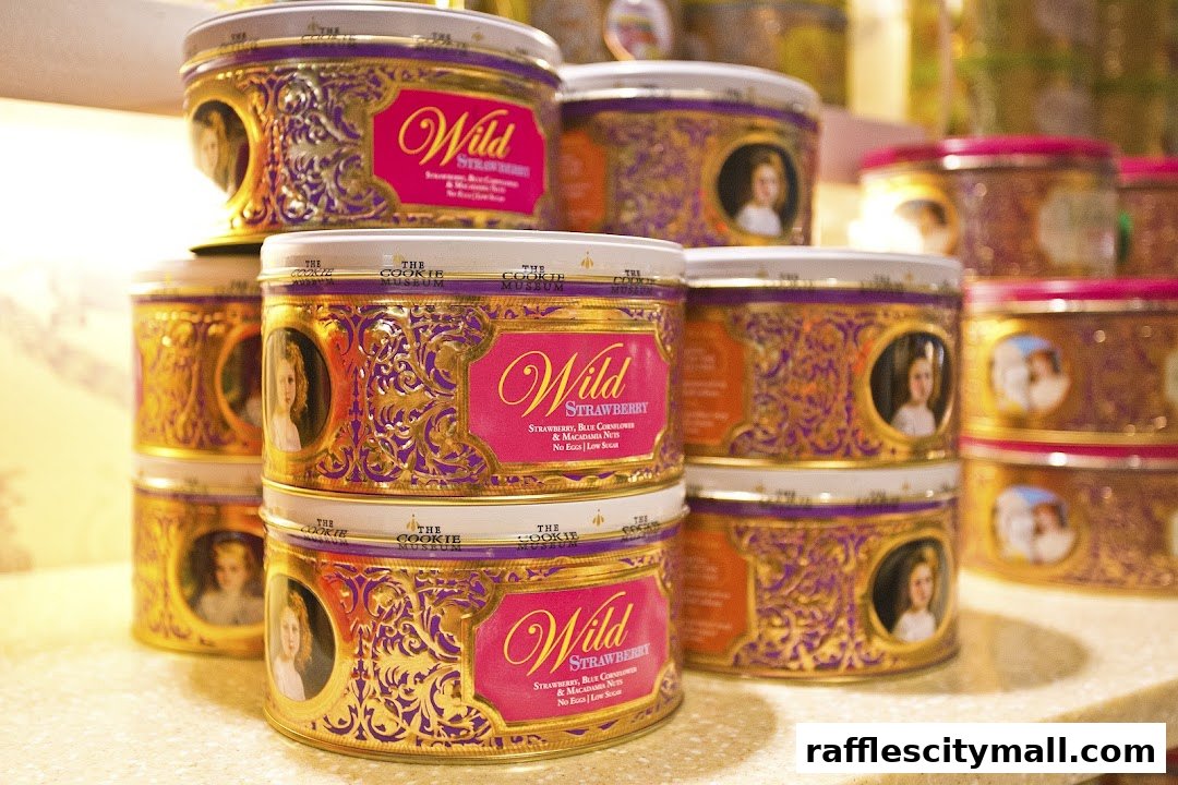 Stacks of decorative cookie tins featuring ornate designs and portraits of children.