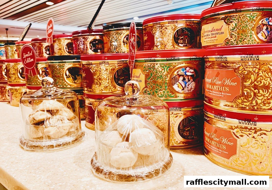 A display of beautifully decorated cookie tins and glass domes filled with cookies.