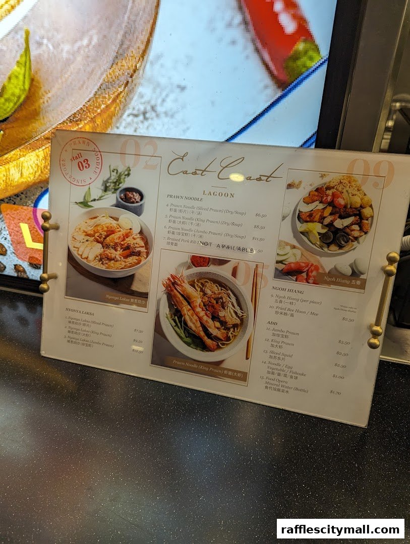 A menu from The Food Place by Food Republic, featuring Prawn Noodles and Nyonya Laksa.