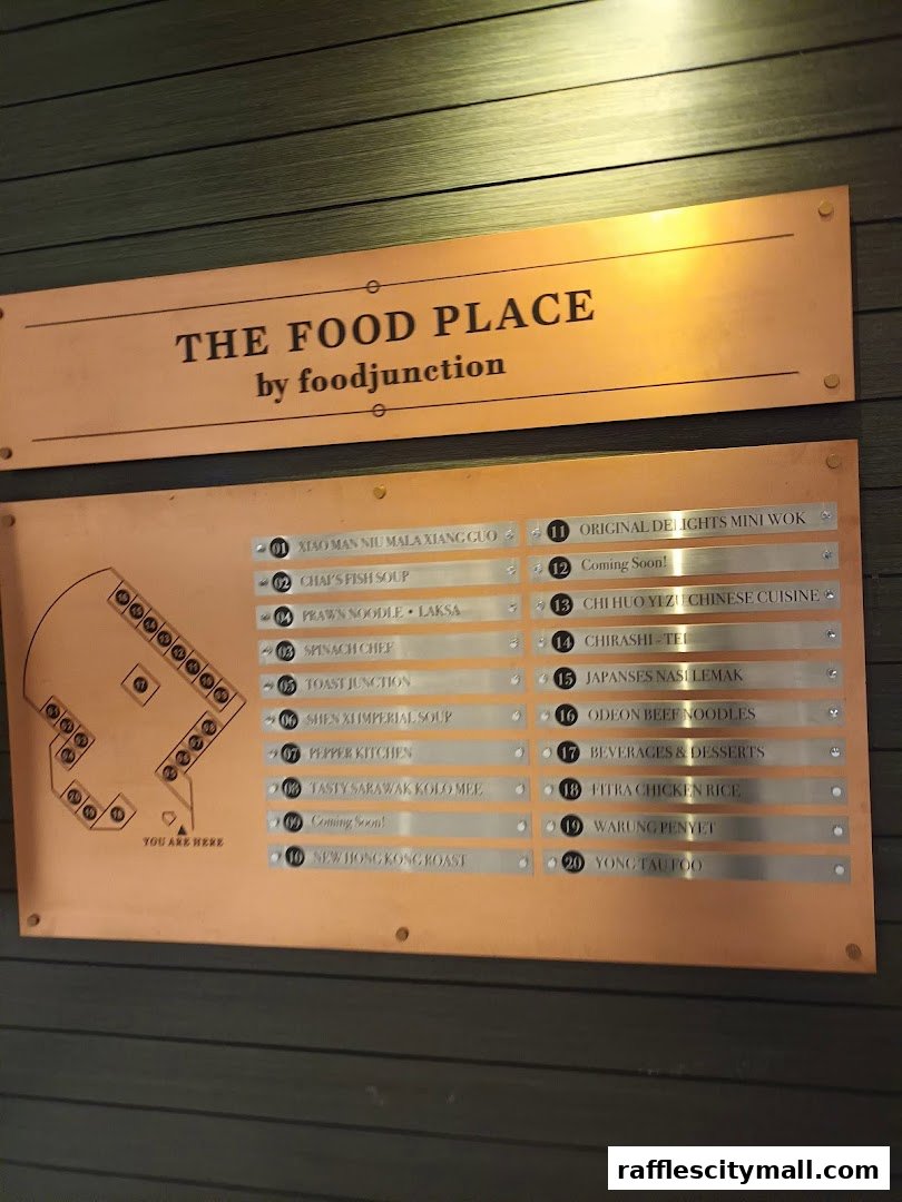 A copper sign displays a list of food stalls and their offerings at The Food Place.