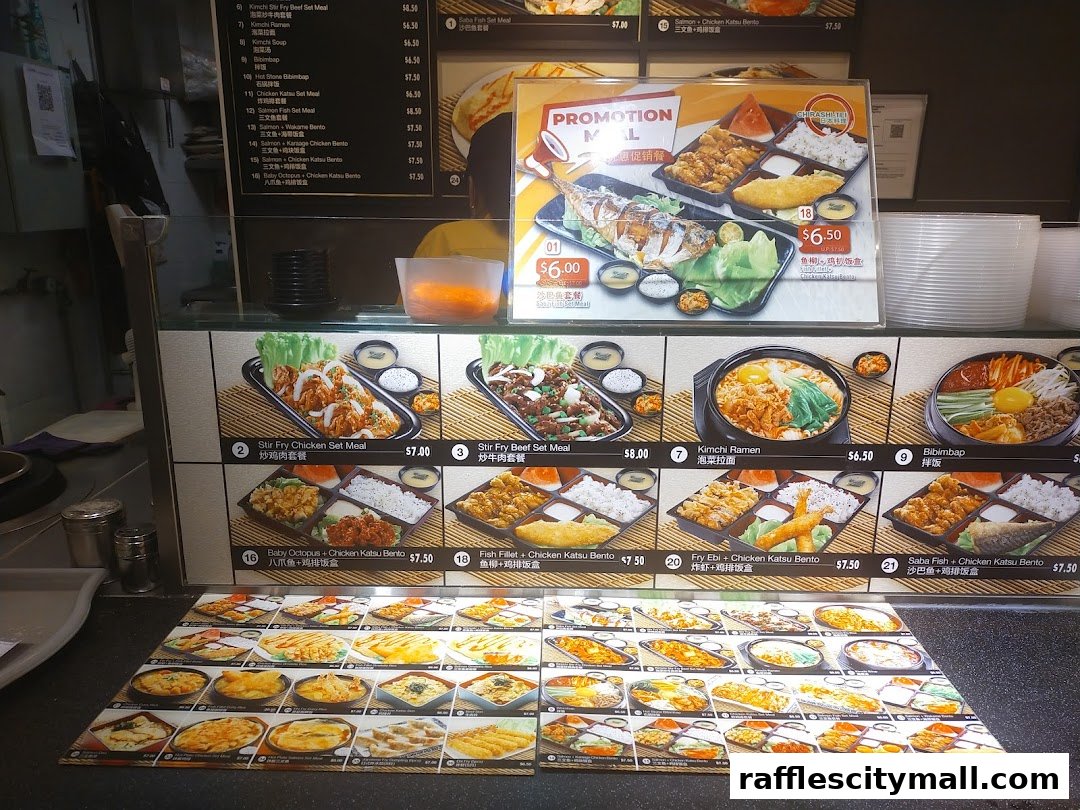 A display of various Asian food set meals and promotions offered at The Food Place by Food Republic.