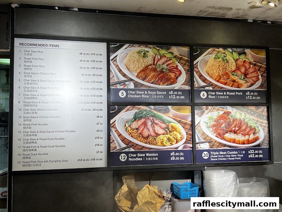 A menu board displaying various rice and noodle dishes with prices and images.