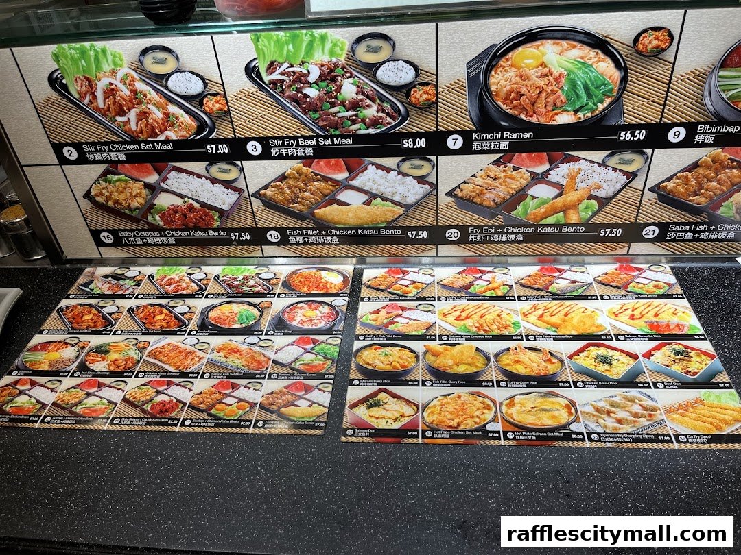 A display of various Korean and Japanese set meals and noodle dishes with prices.