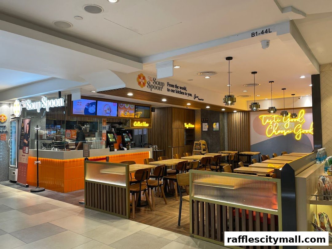 Interior view of The Soup Spoon restaurant with seating, counter, and signage.
