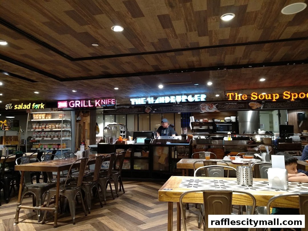 Interior view of The Soup Spoon restaurant with seating and kitchen counter.