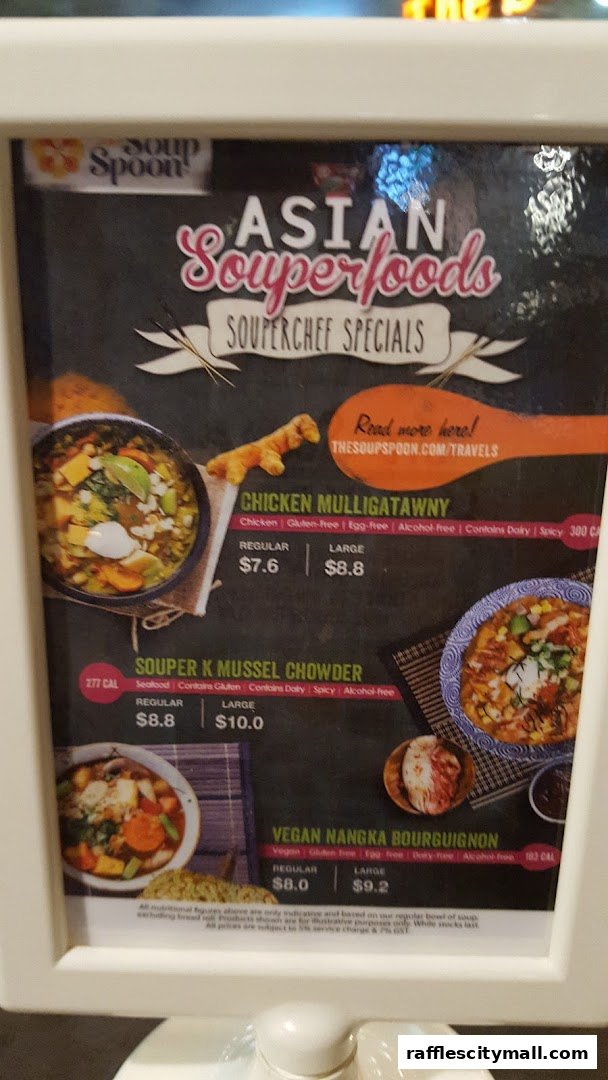 A menu board for The Soup Spoon featuring Asian Souperfoods and Souperchef Specials.