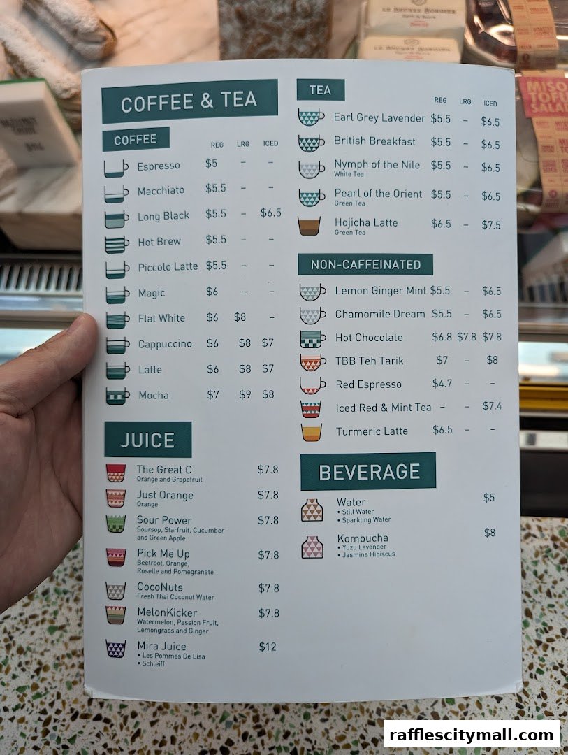 A menu featuring coffee, tea, juice, and beverage options with prices.