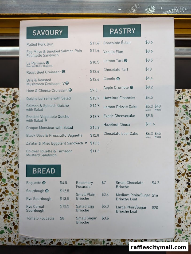 A menu from Tiong Bahru Bakery featuring savory items, pastries, and bread.