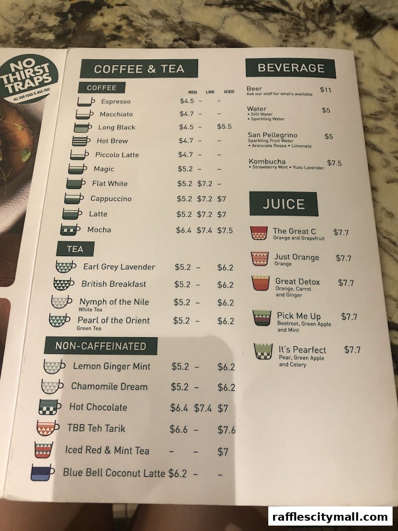 A menu from Tiong Bahru Bakery featuring coffee, tea, beverages, and juices with prices.
