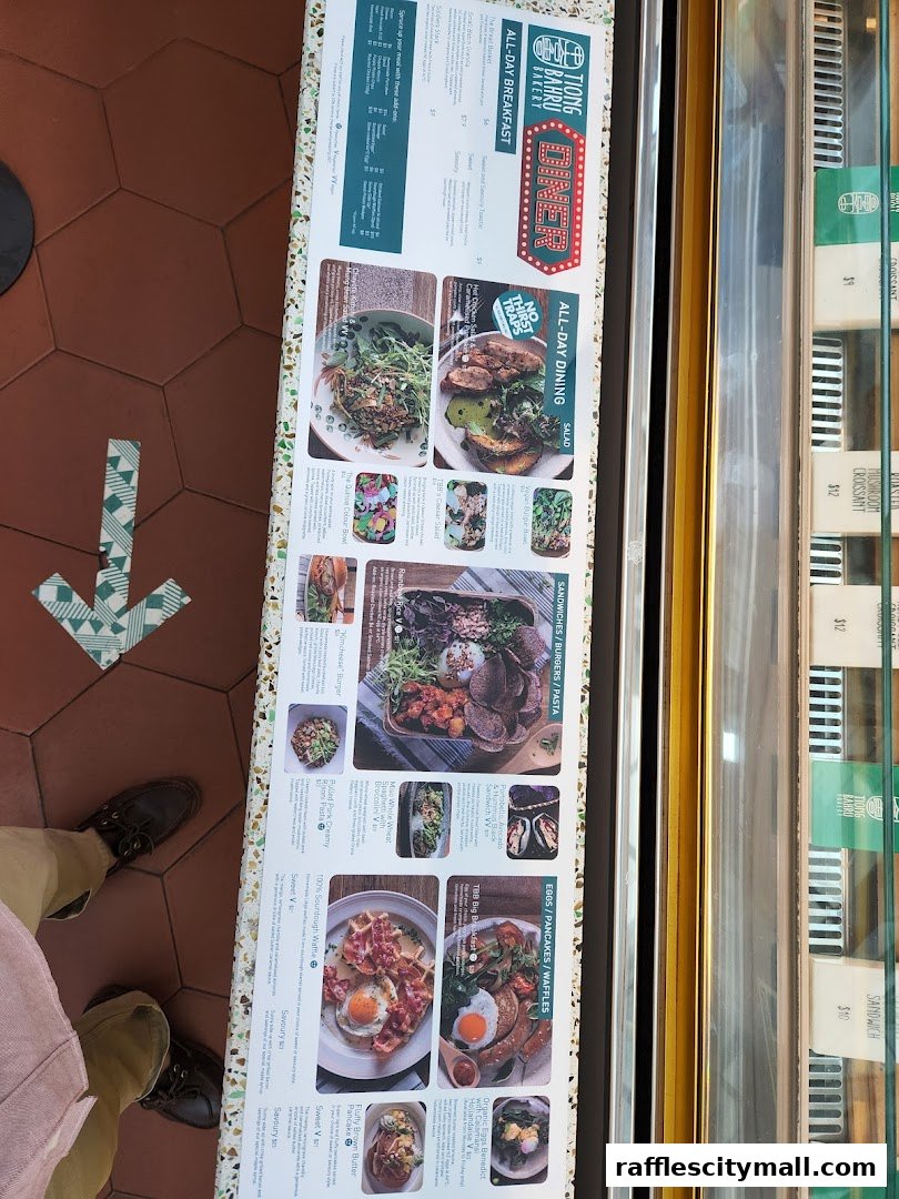 A menu from Tiong Bahru Bakery featuring breakfast, salads, pasta, and sandwiches.