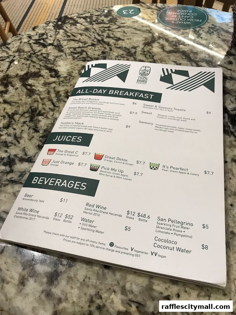 A menu from Tiong Bahru Bakery with sections for All-Day Breakfast, Juices, and Beverages.