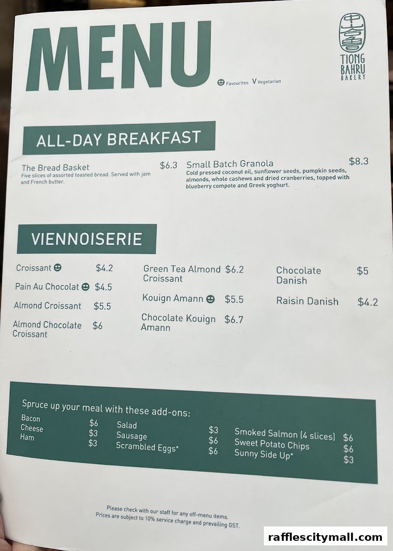 A menu from Tiong Bahru Bakery featuring all-day breakfast and viennoiserie items.