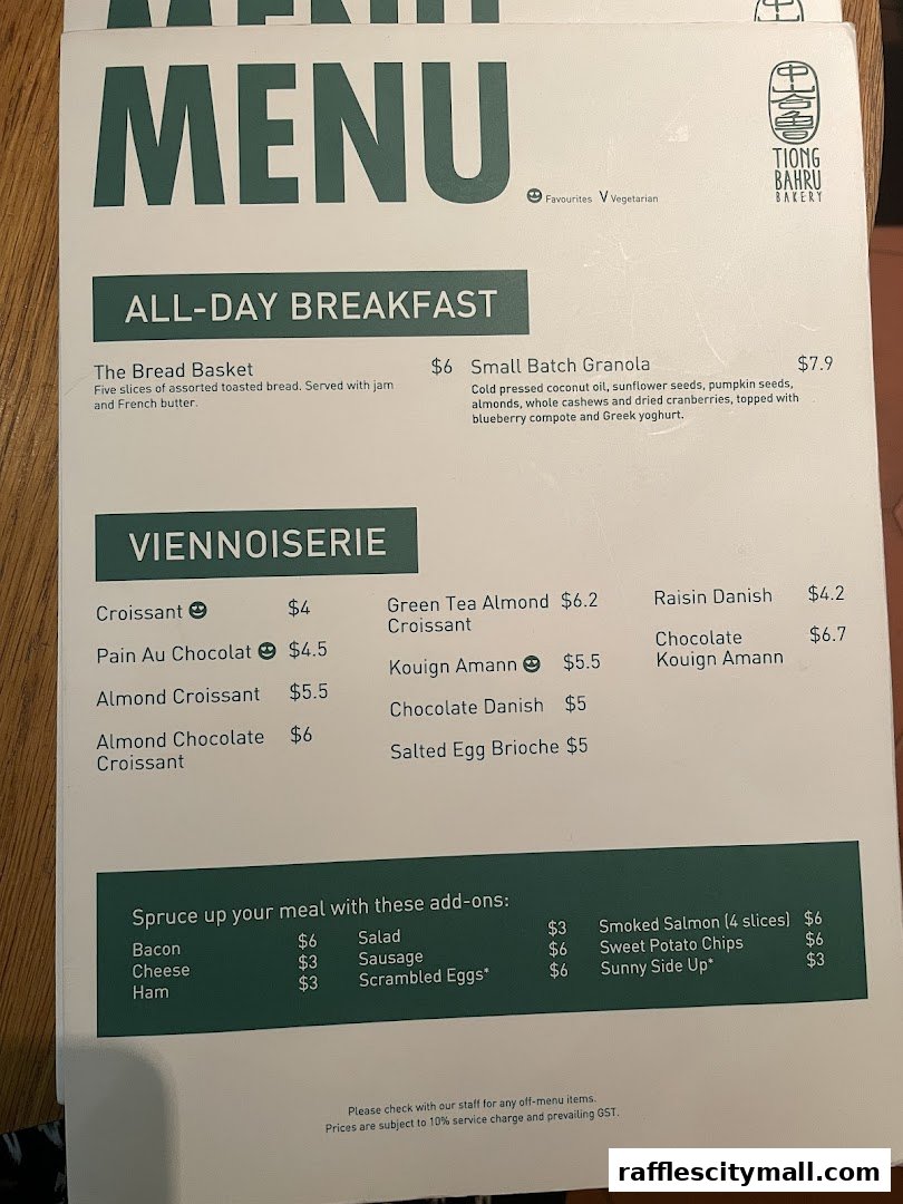 A menu from Tiong Bahru Bakery featuring breakfast items and viennoiseries.