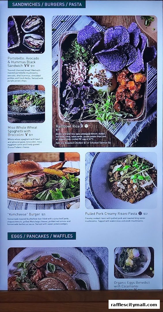 A menu display featuring various sandwiches, pasta, burgers, and egg dishes with accompanying images.