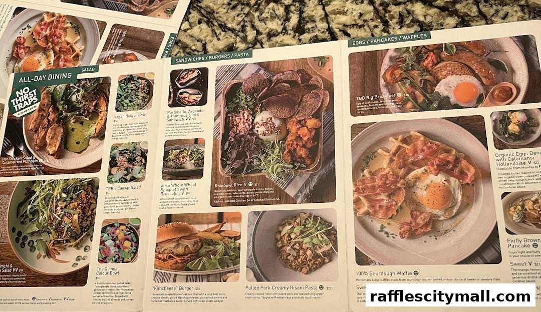 A menu from Tiong Bahru Bakery showcasing various dishes with appealing food photography.
