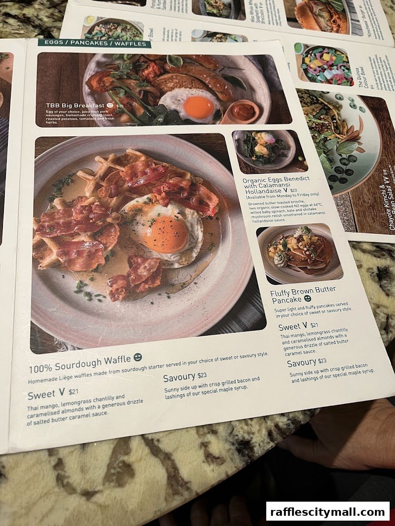A menu featuring breakfast items like waffles, pancakes, and a big breakfast.