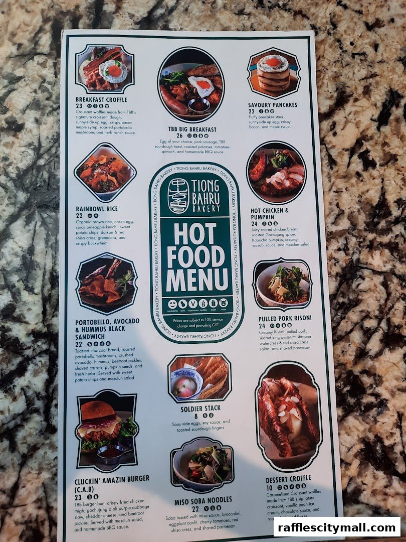 A menu from Tiong Bahru Bakery featuring various hot food items and desserts.