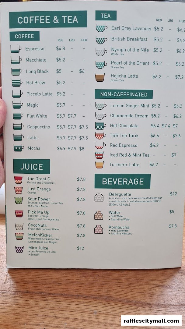 A menu from Tiong Bahru Bakery featuring coffee, tea, juice, and beverage options with prices.