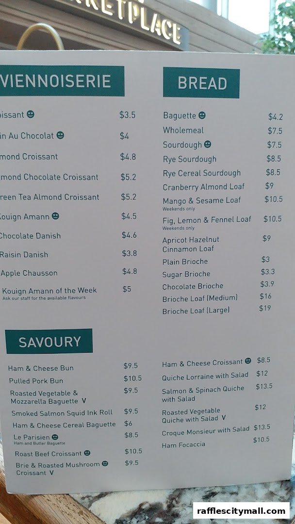 A menu from Tiong Bahru Bakery with categories for Viennoiserie, Bread, and Savoury items.