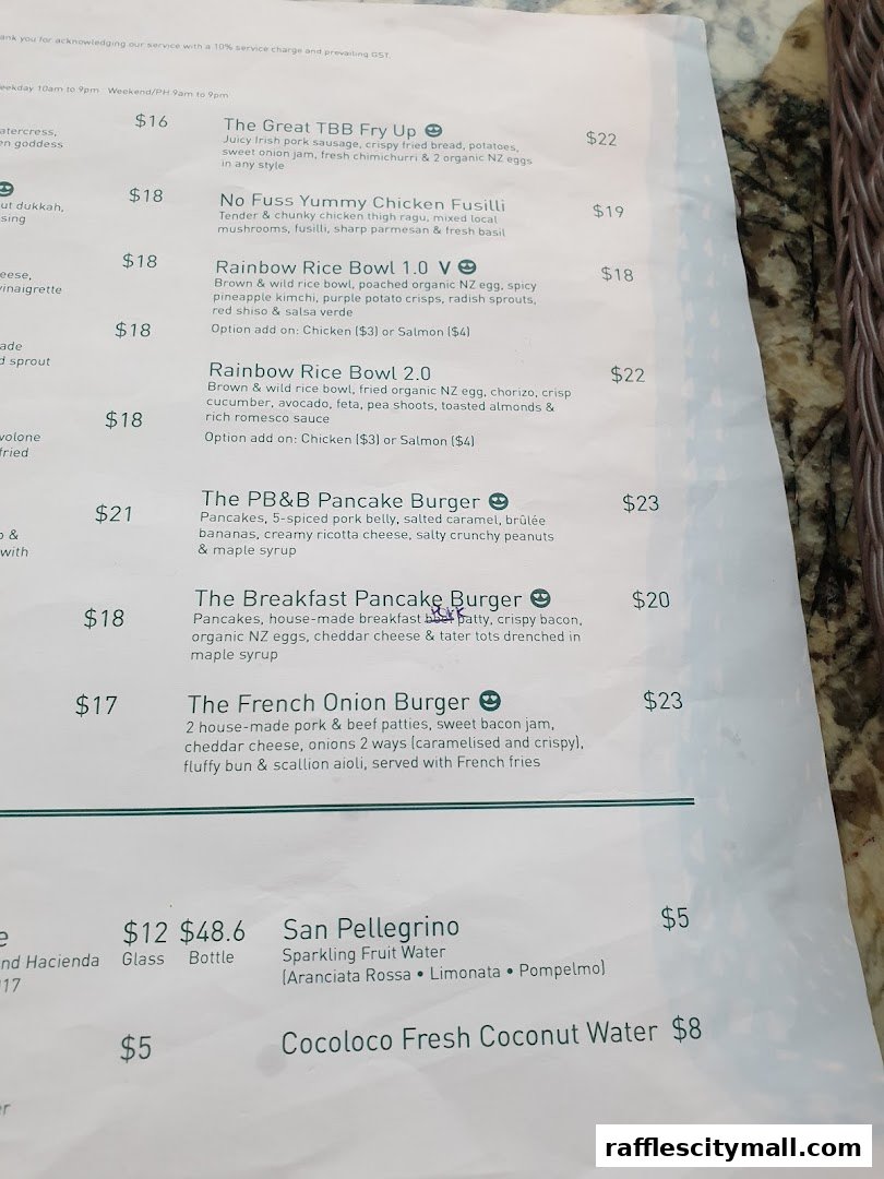 A menu from Tiong Bahru Bakery featuring breakfast items, burgers, and drinks.