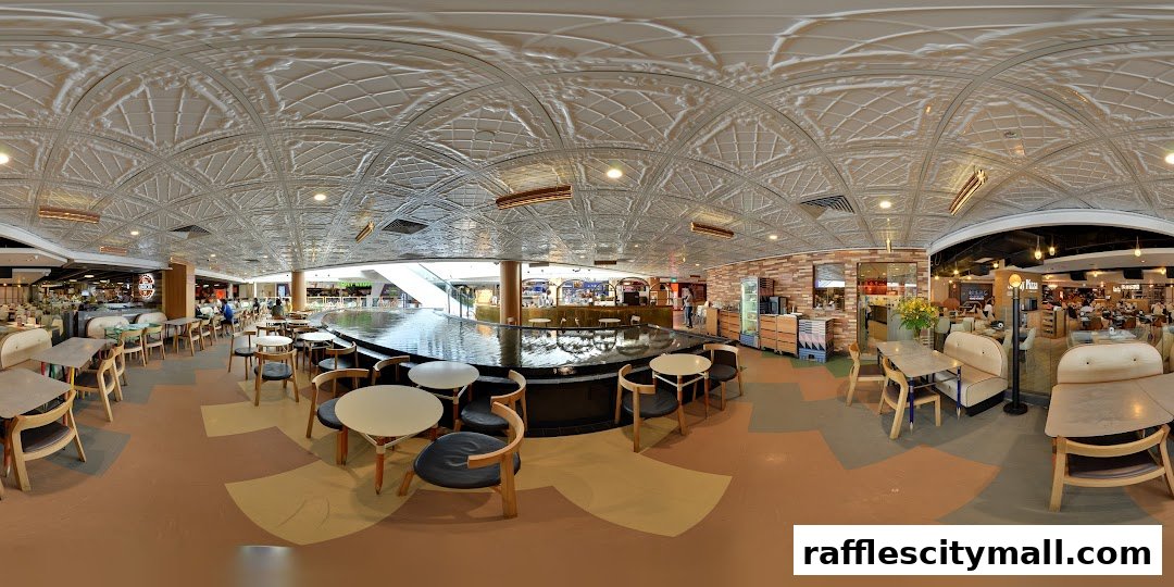Interior view of Tiong Bahru Bakery with seating areas and a water feature.