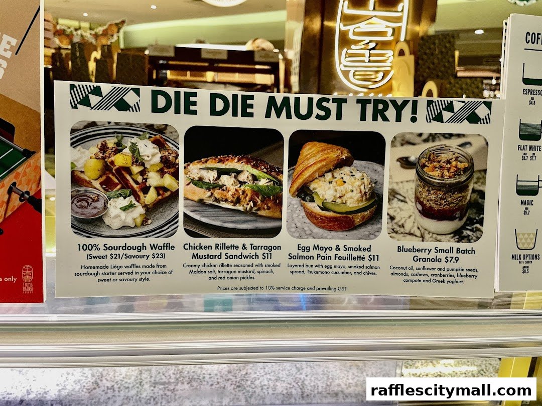 A menu board showcasing four popular food items from Tiong Bahru Bakery.