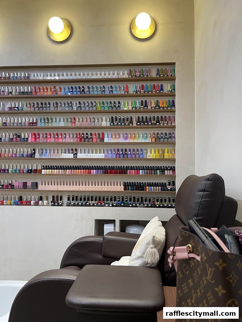 A nail salon interior with a wide selection of nail polish colors displayed on shelves.