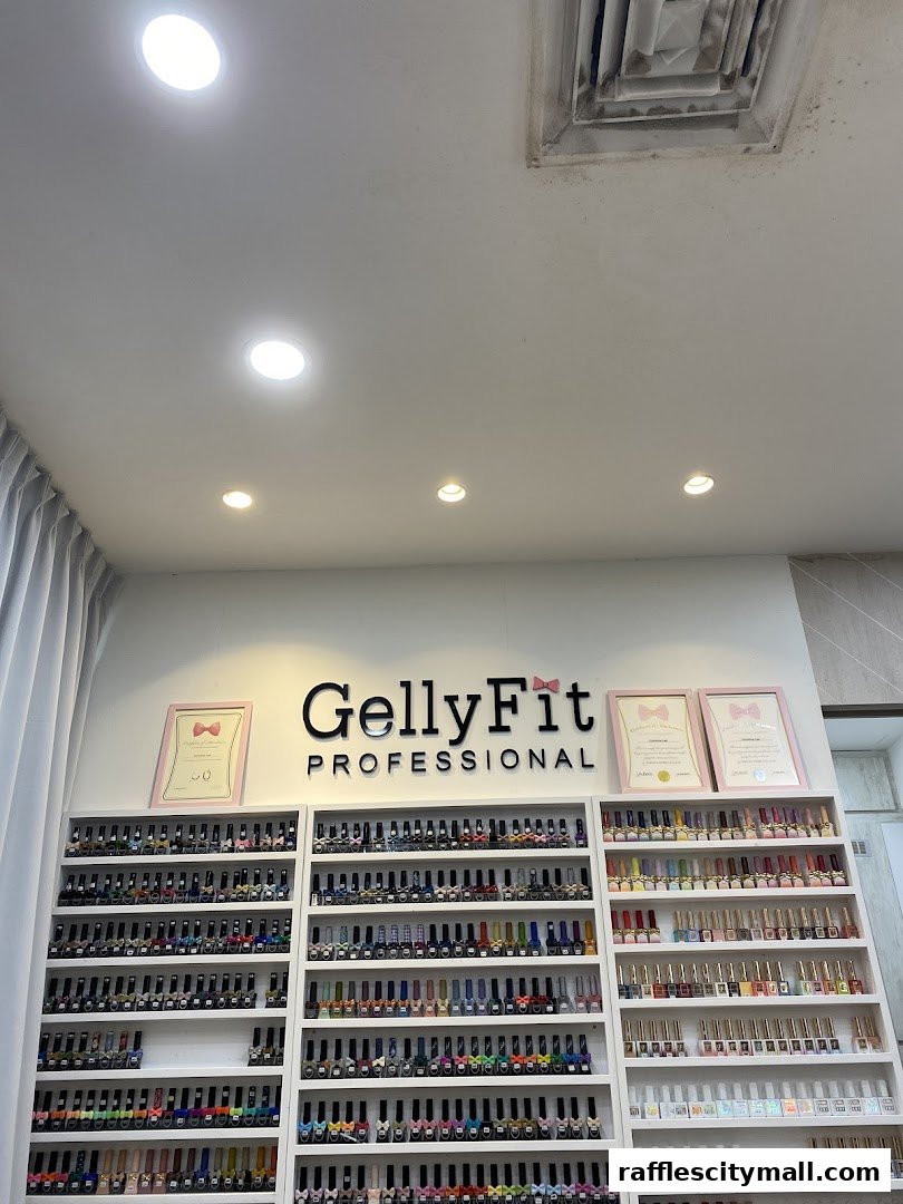 Shelves filled with a wide variety of nail polish bottles, branded as GellyFit Professional.