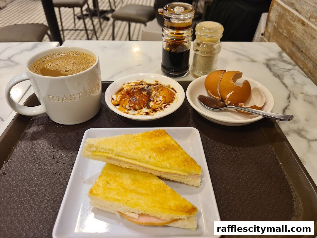 A tray of breakfast items including coffee, toast, and soft-boiled eggs.