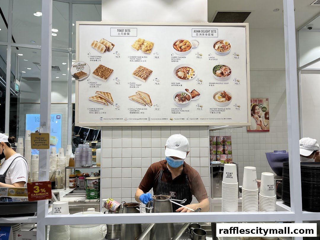 A menu board displaying various toast sets and Asian delight sets with prices.