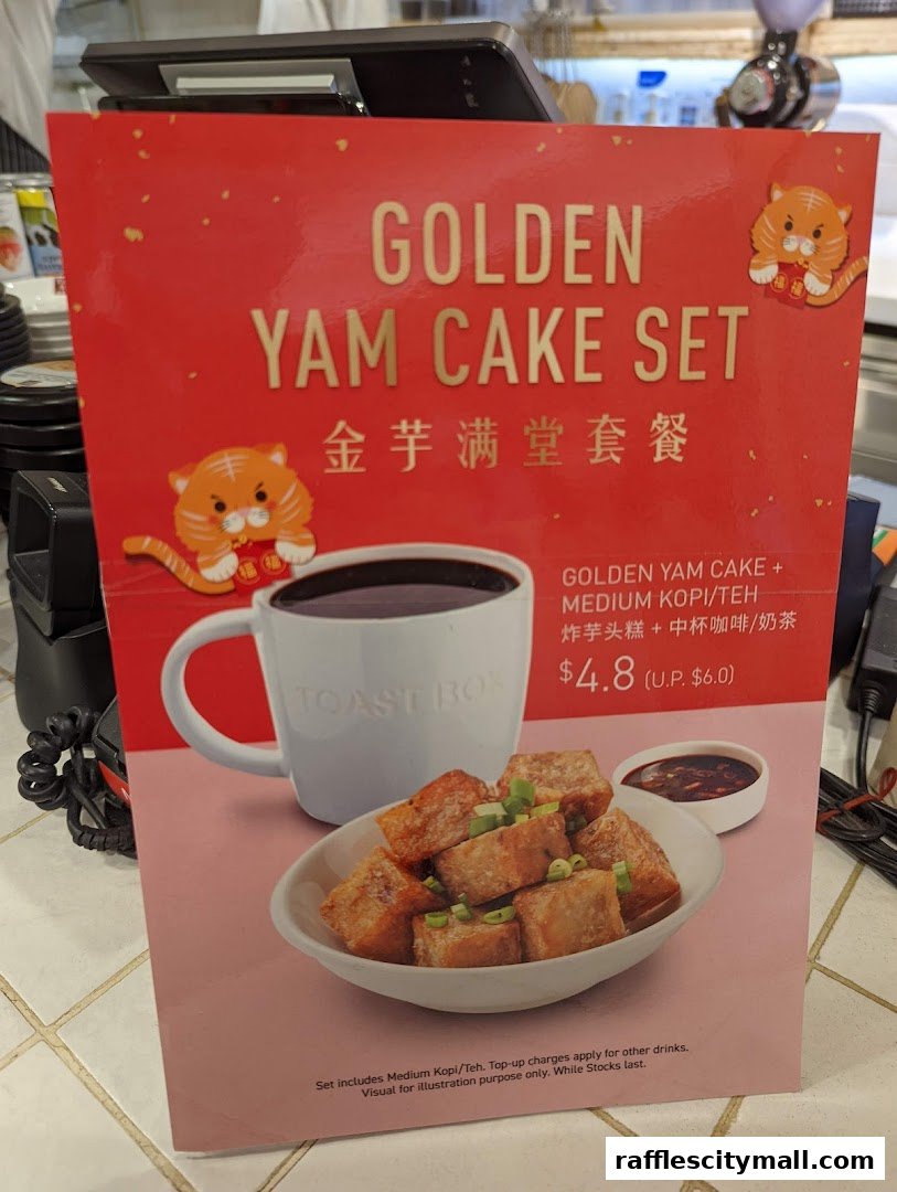 A promotional sign for Toast Box's Golden Yam Cake Set with a drink.
