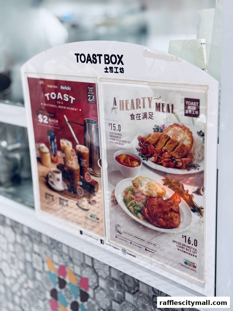 A menu board for Toast Box featuring drinks and meal sets.