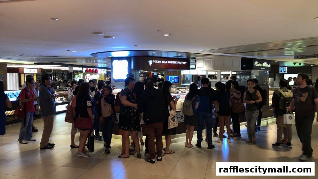 A crowd of people gathered in front of the Tokyo Milk Cheese Factory shop.